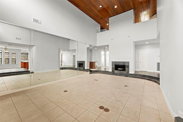 12203 Ashley Circle Dr E, Houston, TX 77071 - unfurnished living room featuring tile patterned floors, a high ceiling, wooden ceiling, a tile fireplace, and recessed lighting