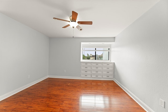12203 Ashley Circle Dr E, Houston, TX 77071 - spare room featuring a ceiling fan, wood finished floors, and baseboards
