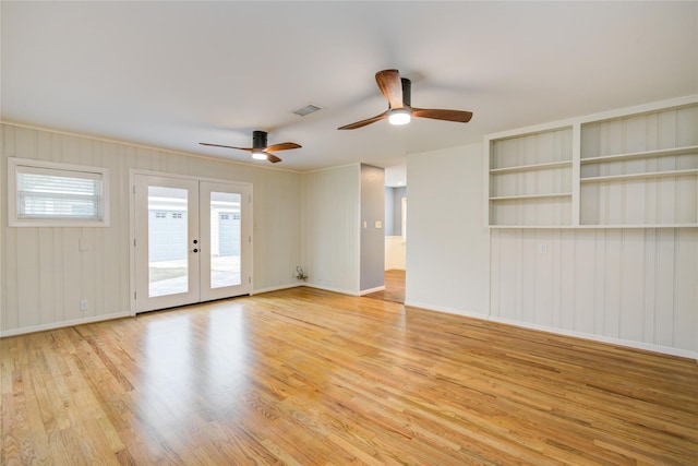 5007 Redstart St, Houston, TX 77035 - unfurnished room featuring wood finished floors, a ceiling fan, french doors, and baseboards