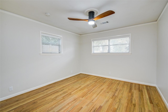 5007 Redstart St, Houston, TX 77035 - spare room with crown molding, ceiling fan, baseboards, wood finished floors, and healthy amount of natural light