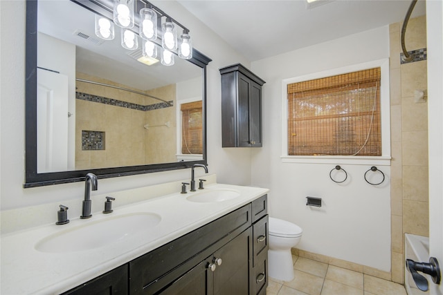 5007 Redstart St, Houston, TX 77035 - full bathroom featuring double vanity, toilet, and tile patterned floors