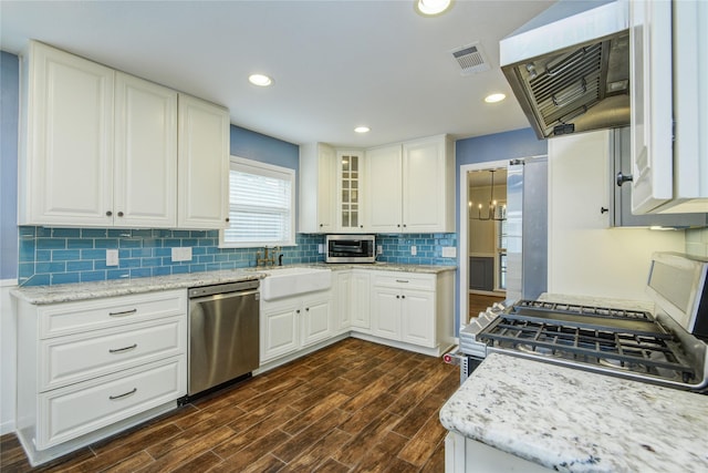 5007 Redstart St, Houston, TX 77035 - kitchen with dishwasher, a sink, exhaust hood, range with gas stovetop, and backsplash