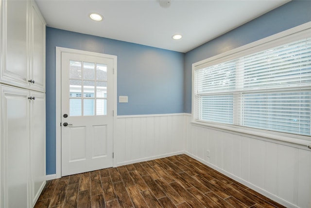 5007 Redstart St, Houston, TX 77035 - doorway to outside featuring wainscoting, dark wood finished floors, and recessed lighting