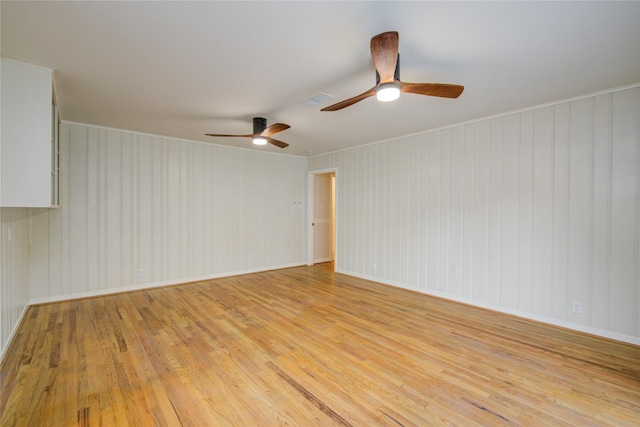 5007 Redstart St, Houston, TX 77035 - empty room with light wood-type flooring, ceiling fan, and baseboards