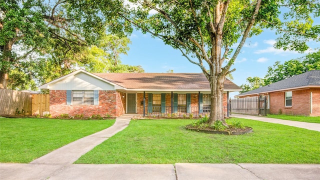 5007 Redstart St, Houston, TX 77035 - ranch-style house with covered porch, brick siding, driveway, and a gate