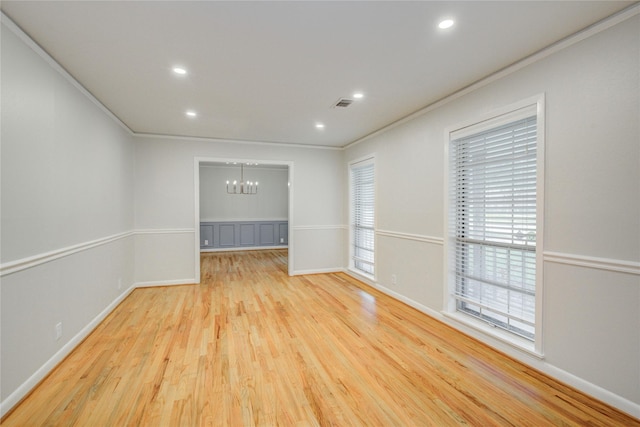 5007 Redstart St, Houston, TX 77035 - empty room with a chandelier, ornamental molding, wood finished floors, recessed lighting, and baseboards