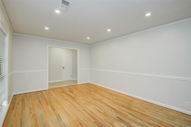 5007 Redstart St, Houston, TX 77035 - spare room featuring ornamental molding, recessed lighting, wood finished floors, and baseboards