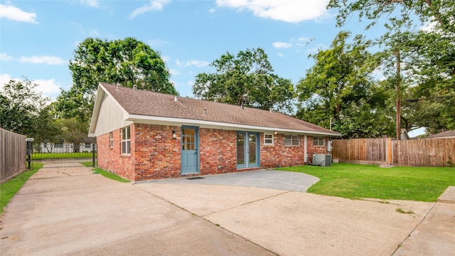 5007 Redstart St, Houston, TX 77035 - view of front of property featuring a patio area, driveway, central AC unit, and brick siding