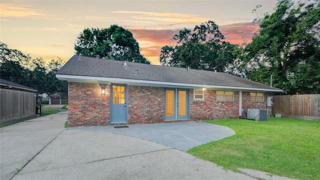 5007 Redstart St, Houston, TX 77035 - view of front of house featuring brick siding, a shingled roof, and cooling unit