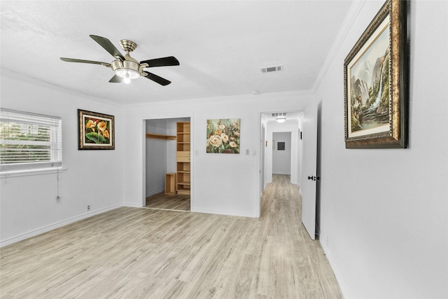 7650 US Highway 69 S, Woodville, TX 75979 - unfurnished bedroom featuring light wood finished floors, ornamental molding, and a ceiling fan