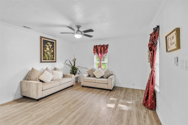 7650 US Highway 69 S, Woodville, TX 75979 - living area featuring wood finished floors, crown molding, and ceiling fan