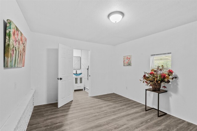 7650 US Highway 69 S, Woodville, TX 75979 - unfurnished room with wood finished floors