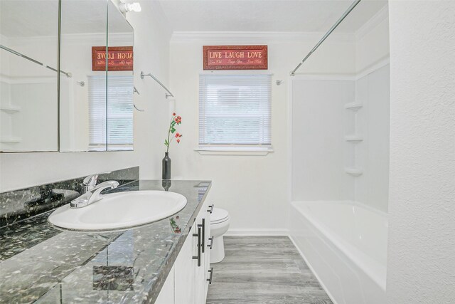 7650 US Highway 69 S, Woodville, TX 75979 - full bathroom with ornamental molding, vanity, wood finished floors, and tub / shower combination
