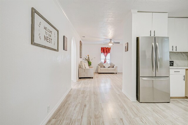 7650 US Highway 69 S, Woodville, TX 75979 - corridor with light wood finished floors, arched walkways, and crown molding