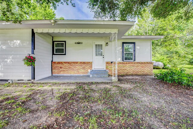 7650 US Highway 69 S, Woodville, TX 75979 - view of front of house featuring brick siding