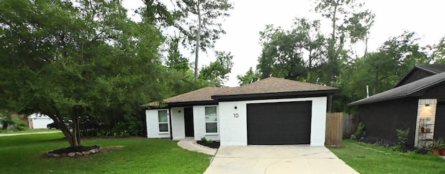 10 N Wavy Oak Cir, The Woodlands, TX 77381 - ranch-style house with driveway, a garage, and roof with shingles