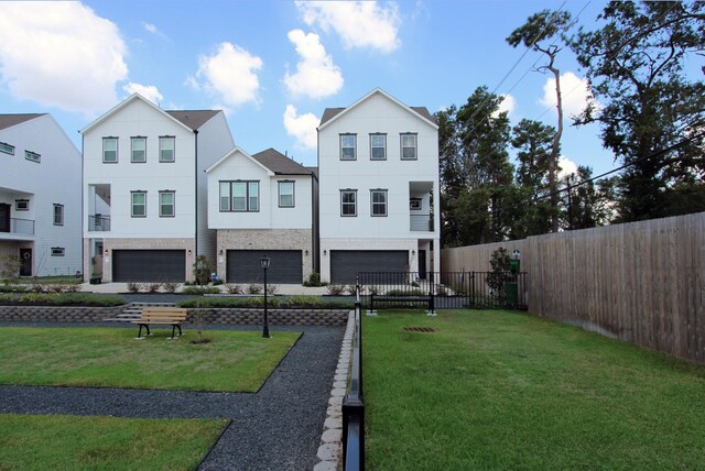5502D Wheatley St, Houston, TX 77091 - rear view of house featuring a garage and stucco siding