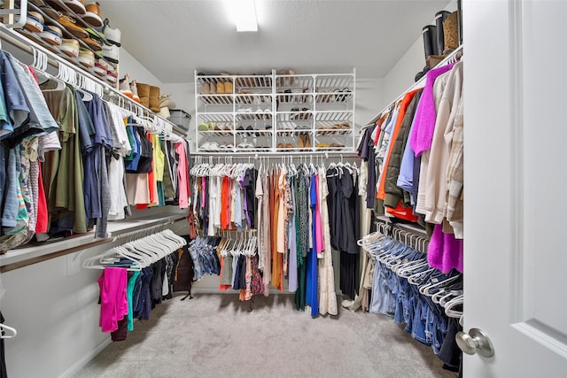 2331 Hagerman Rd, Conroe, TX 77384 - walk in closet featuring carpet flooring