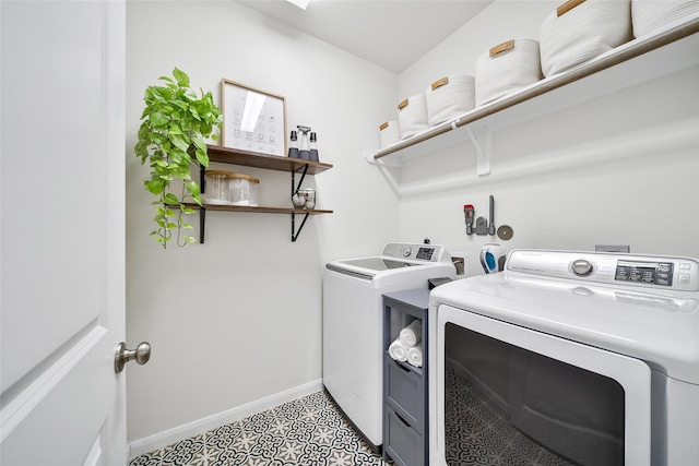 2331 Hagerman Rd, Conroe, TX 77384 - laundry area with separate washer and dryer and baseboards