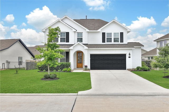 2331 Hagerman Rd, Conroe, TX 77384 - traditional-style home featuring a shingled roof, a garage, and driveway