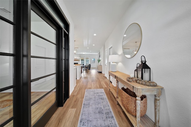 2331 Hagerman Rd, Conroe, TX 77384 - hallway with light wood finished floors and recessed lighting