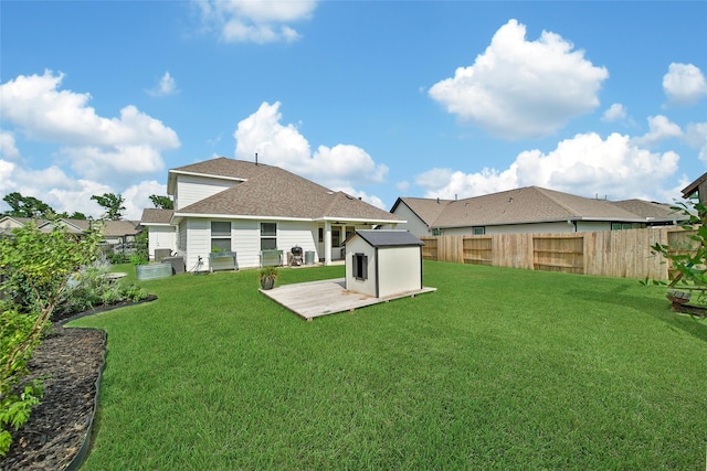 2331 Hagerman Rd, Conroe, TX 77384 - rear view of property featuring a shingled roof and a wooden deck