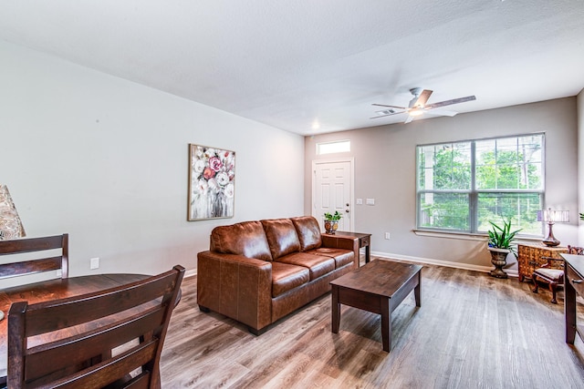 4403 2nd St, Bacliff, TX 77518 - living area featuring light wood-style floors, ceiling fan, and baseboards