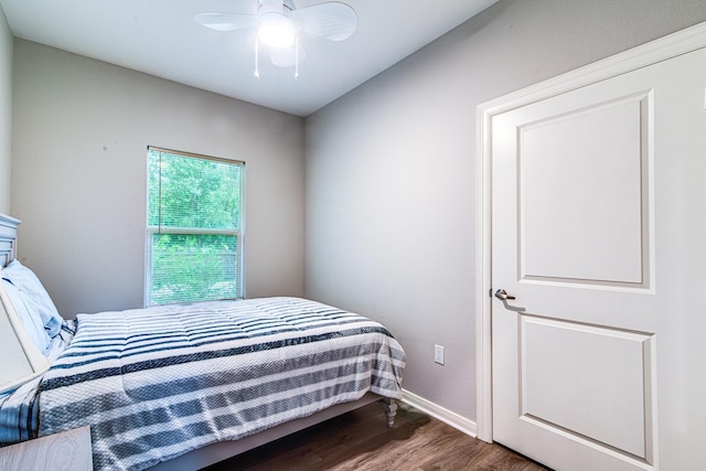 4403 2nd St, Bacliff, TX 77518 - bedroom featuring dark wood-style flooring, baseboards, and a ceiling fan
