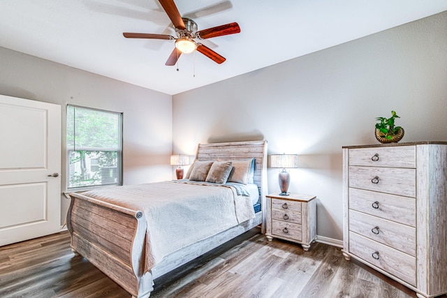 4403 2nd St, Bacliff, TX 77518 - bedroom with wood finished floors, ceiling fan, and baseboards