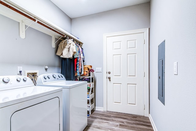 4403 2nd St, Bacliff, TX 77518 - laundry room with independent washer and dryer, wood finished floors, electric panel, and baseboards