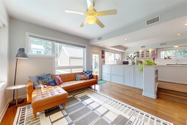 2737 Werlein Ave, Houston, TX 77005 - living area featuring light wood-type flooring, healthy amount of natural light, recessed lighting, and ceiling fan