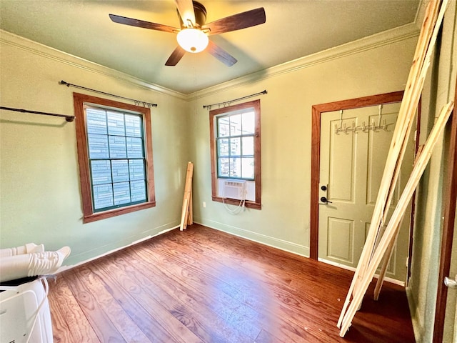1317 Church St, Galveston, TX 77550 - entryway featuring ornamental molding, wood finished floors, ceiling fan, cooling unit, and baseboards