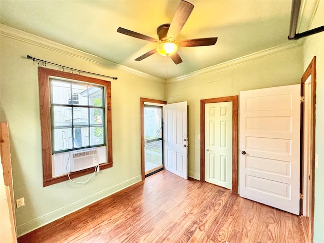 1317 Church St, Galveston, TX 77550 - unfurnished bedroom featuring light wood-style floors, crown molding, cooling unit, ceiling fan, and baseboards