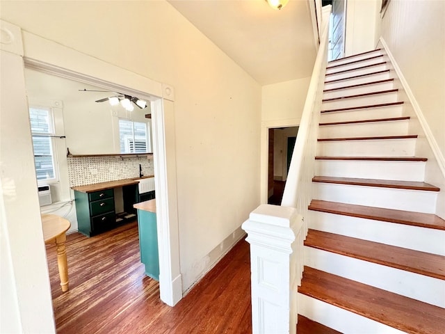1317 Church St, Galveston, TX 77550 - staircase featuring wood finished floors, ceiling fan, healthy amount of natural light, and baseboards