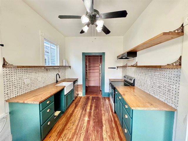 1317 Church St, Galveston, TX 77550 - kitchen featuring open shelves, appliances with stainless steel finishes, wooden counters, and a sink