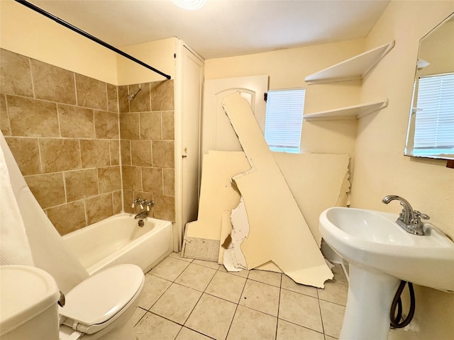 1317 Church St, Galveston, TX 77550 - bathroom with toilet, tile patterned floors, and shower / bathtub combination with curtain