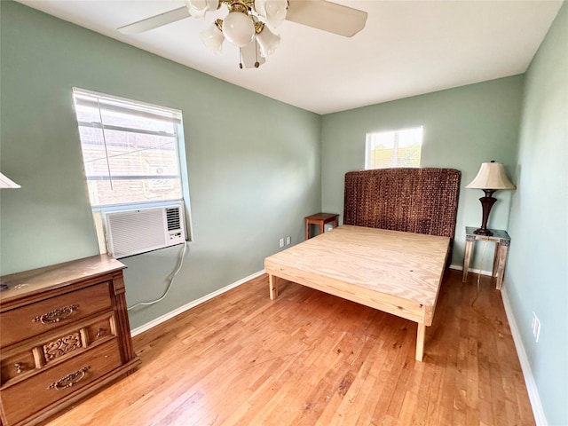 1317 Church St, Galveston, TX 77550 - bedroom featuring hardwood / wood-style floors, baseboards, a ceiling fan, and cooling unit