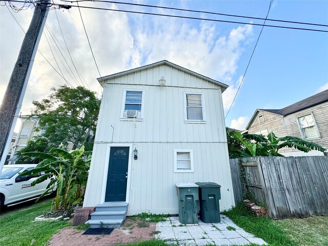 1317 Church St, Galveston, TX 77550 - back of property with entry steps and cooling unit