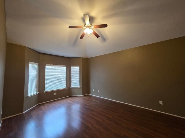 19518 Grand Colony Ct, Katy, TX 77449 - spare room with dark wood-style flooring, a ceiling fan, and baseboards