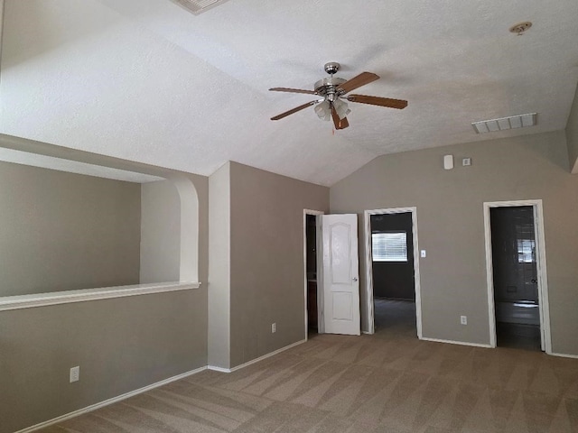 19518 Grand Colony Ct, Katy, TX 77449 - unfurnished bedroom featuring carpet flooring, vaulted ceiling, baseboards, a textured ceiling, and ensuite bath