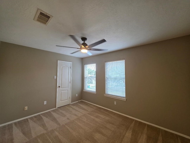 19518 Grand Colony Ct, Katy, TX 77449 - unfurnished room with baseboards, ceiling fan, and carpet floors