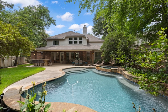 27 N Longsford Cir, The Woodlands, TX 77382 - view of pool featuring a patio area, a pool with connected hot tub, and outdoor dining area