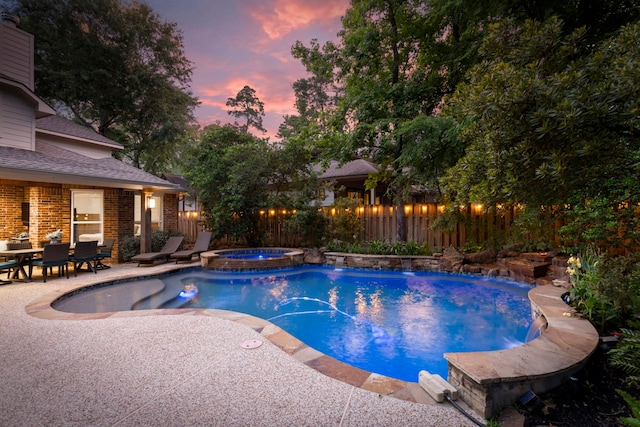 27 N Longsford Cir, The Woodlands, TX 77382 - view of swimming pool with a patio, a fenced backyard, and a pool with connected hot tub