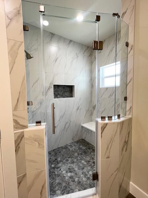 10516 Exeter St, Houston, TX 77093 - full bathroom with a marble finish shower