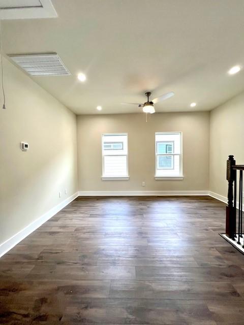10516 Exeter St, Houston, TX 77093 - unfurnished living room with dark wood-style flooring, recessed lighting, and a ceiling fan