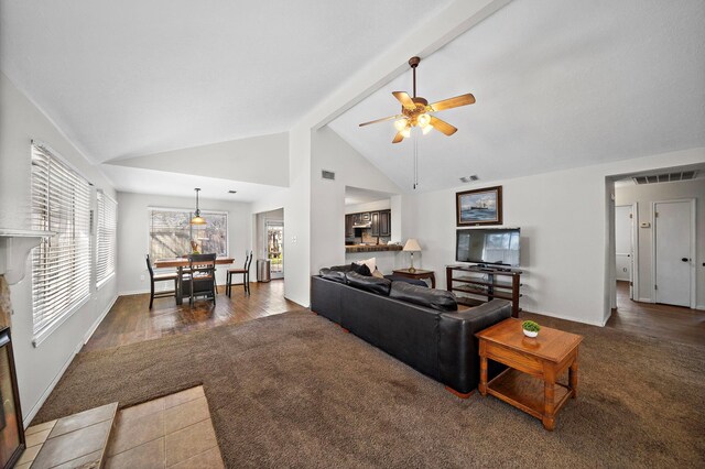 22303 Acorn Chase Dr, Spring, TX 77389 - living area with ceiling fan, beamed ceiling, baseboards, carpet flooring, and high vaulted ceiling