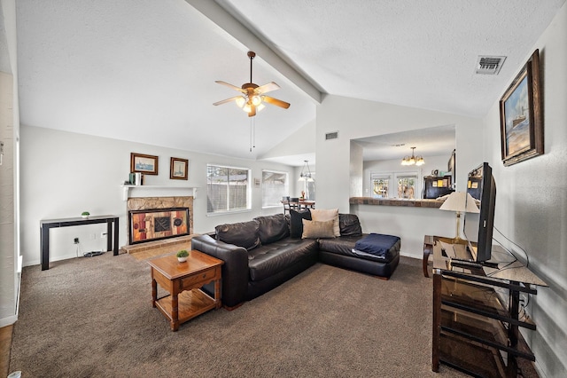 22303 Acorn Chase Dr, Spring, TX 77389 - living area with a chandelier, carpet flooring, a fireplace, plenty of natural light, and a textured ceiling