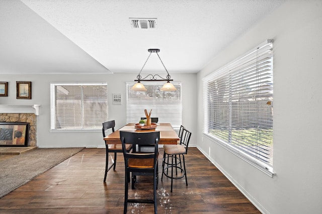 22303 Acorn Chase Dr, Spring, TX 77389 - dining room with dark wood-style floors, a fireplace, and baseboards