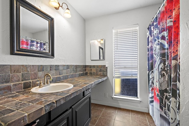 22303 Acorn Chase Dr, Spring, TX 77389 - full bath featuring decorative backsplash, vanity, tile patterned floors, and baseboards