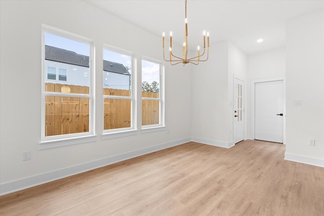 5306 San Juan St, Houston, TX 77020 - unfurnished room featuring a chandelier, light wood-style floors, baseboards, and recessed lighting